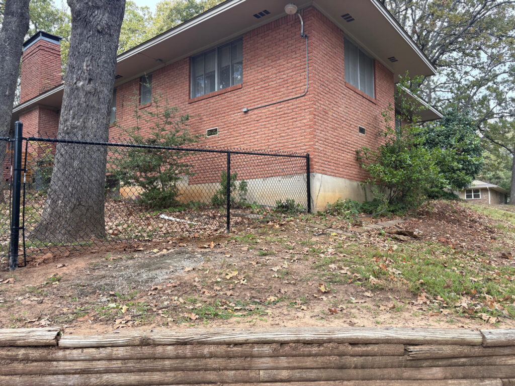 Black vinyl-coated chain link fence installed by Fence Guy