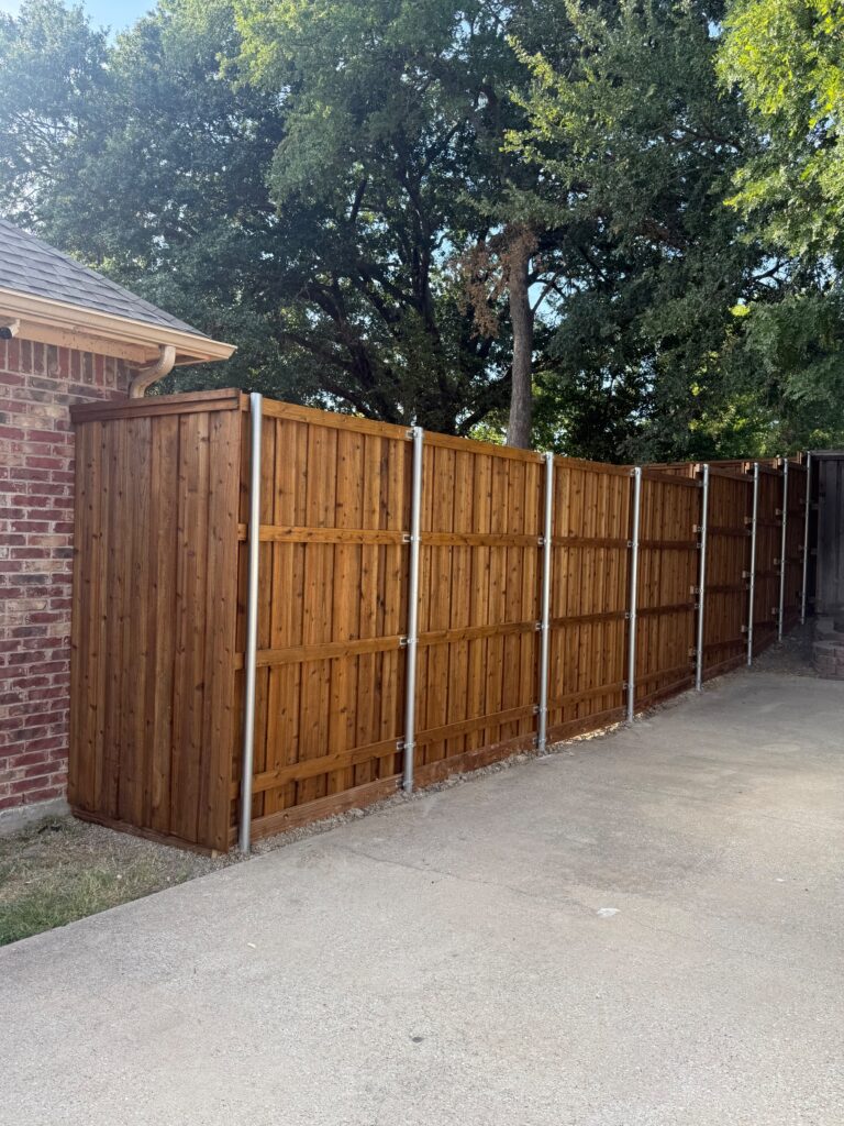 Cedar wood fence with steel posts installed by Fence Guy