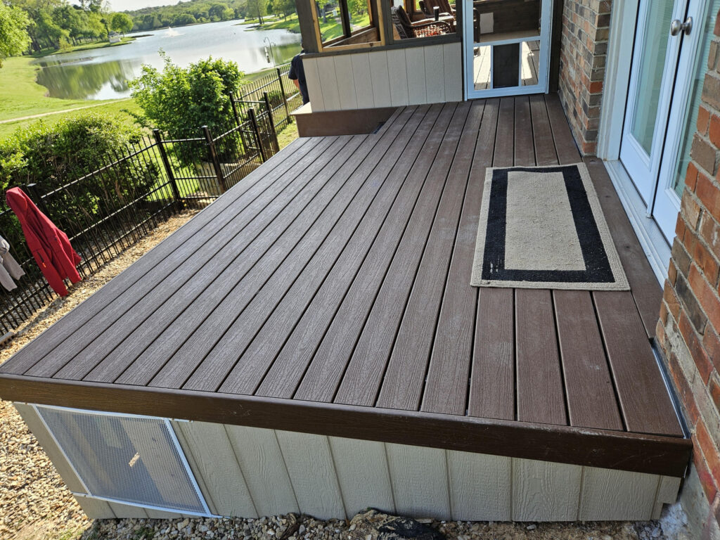 Composite deck installed by Fence Guy overlooking the lake