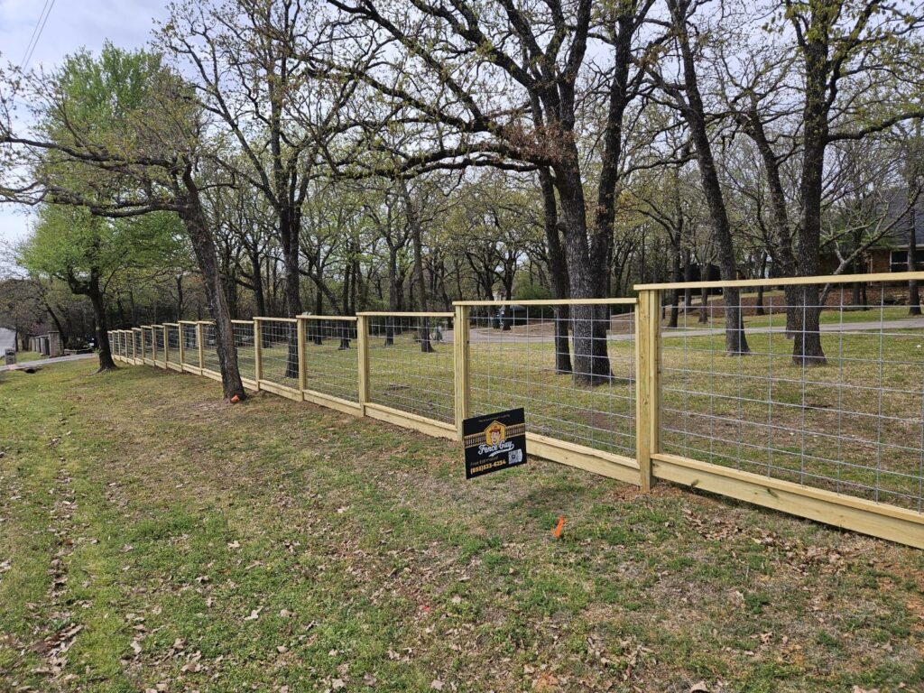 Wood frame and welded wire ranch fencing installed by Fence Guy