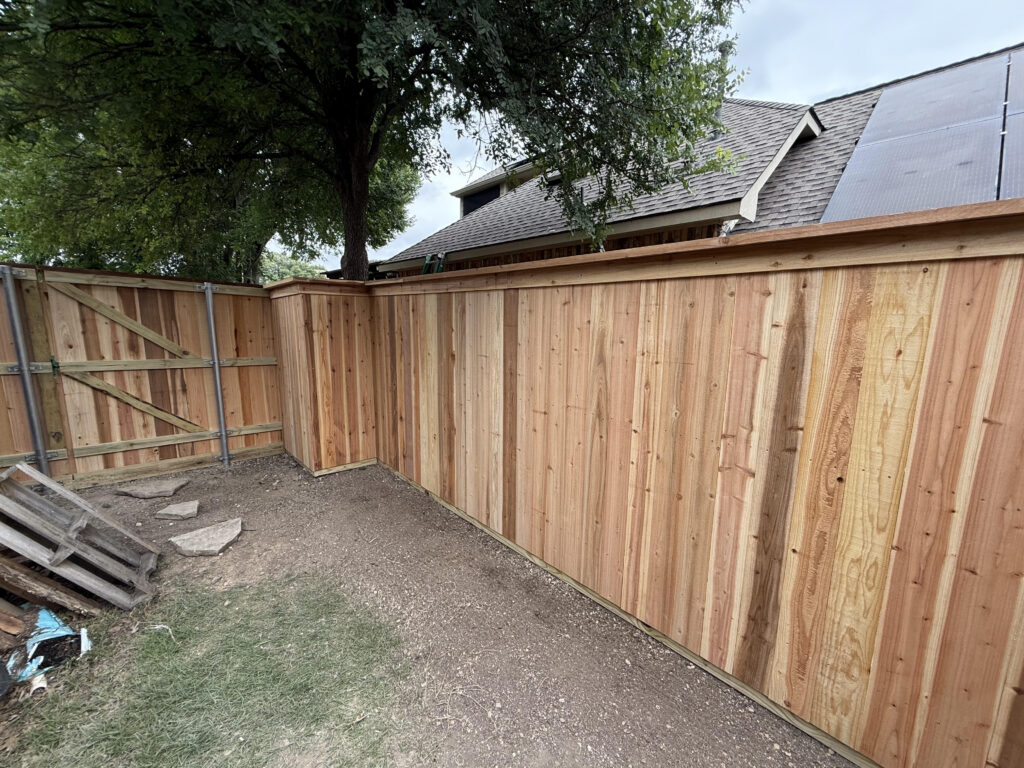 New cedar privacy fence with cap trim installed by Fence Guy