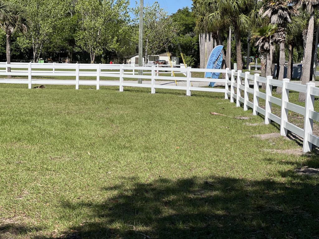 White vinyl ranch rail fence installed by Fence Guy