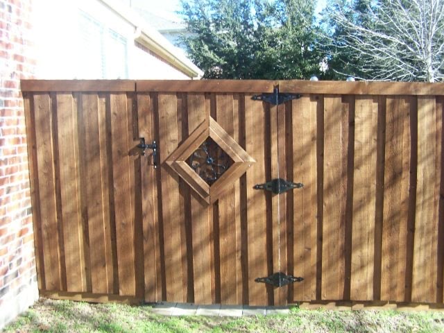 Custom wood gate with diamond iron window