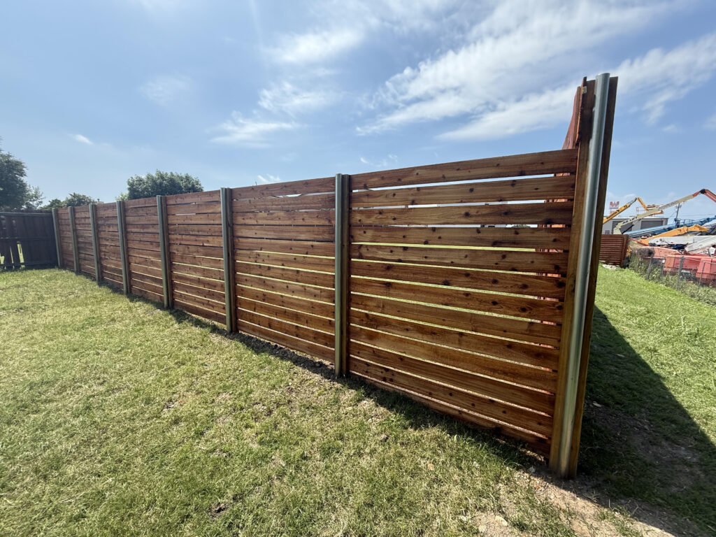 Horizontal cedar fence with steel posts installed by Fence Guy in DFW and North Texas